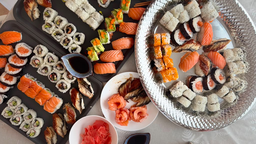 An assorted spread of sushi rolls and nigiri